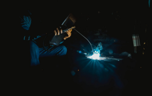 a welder wearing protective suit
